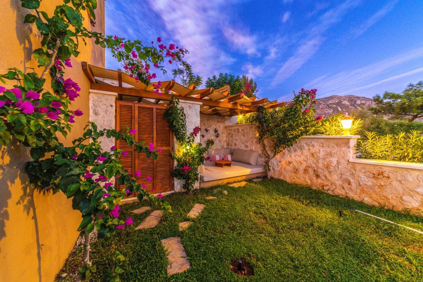 Garden wall with bougainvillea at dusk